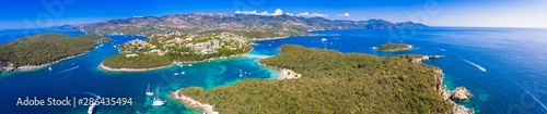 Aerial view of iconic paradise sandy beaches with turquoise sea in complex islands of Agios Nikolaos and Mourtos in Sivota area, Epirus, Greece © gatsi