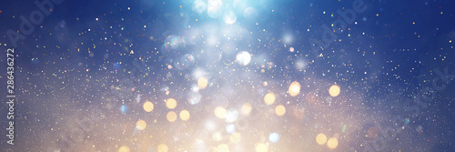 abstract glitter silver  purple  blue and gold lights background. de-focused. banner