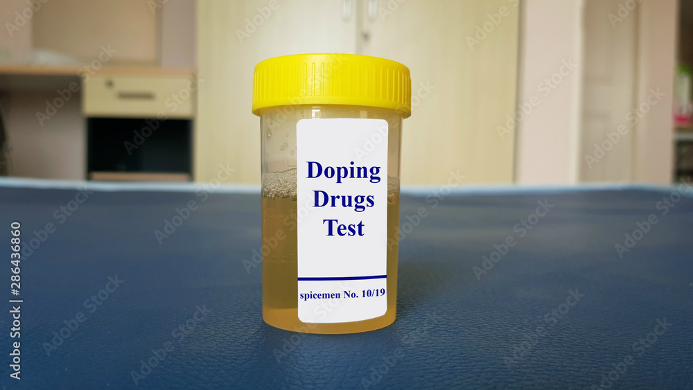 Laboratory sample of urine for doping test. Doping is the used of banned athletic performance enhancing drug by athlete in competitive sport. Medical test in sport medicine concept. Laboratory sample of urine for doping test. Doping is the used of banned athletic performance enhancing drug by athlete in competitive sport. Medical test in sport medicine concept.