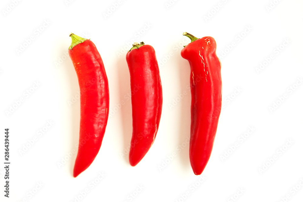 Red chili peppers isolated on white background Red chili peppers isolated on white background