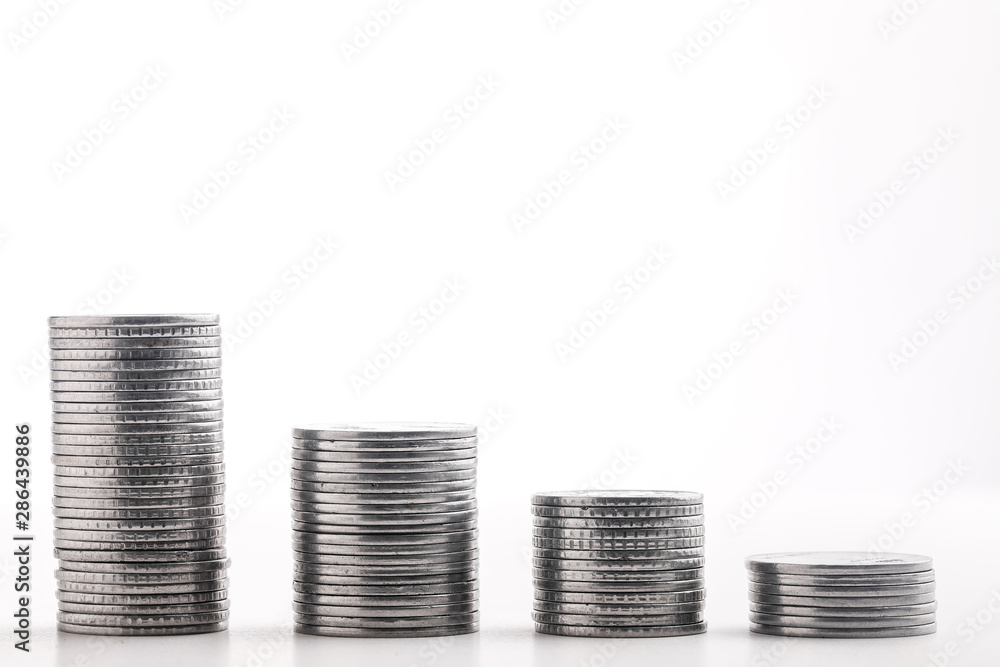 Stack of indian currency in coins arranged as a graph on white background Stack of indian currency in coins arranged as a graph on white background