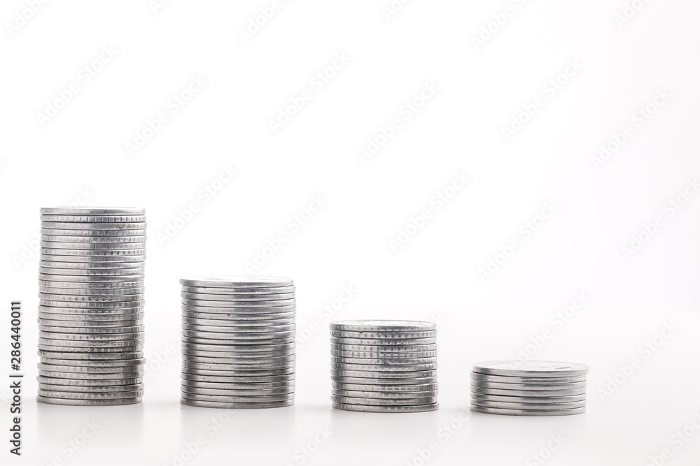 Stack of indian currency in coins arranged as a graph on white background Stack of indian currency in coins arranged as a graph on white background
