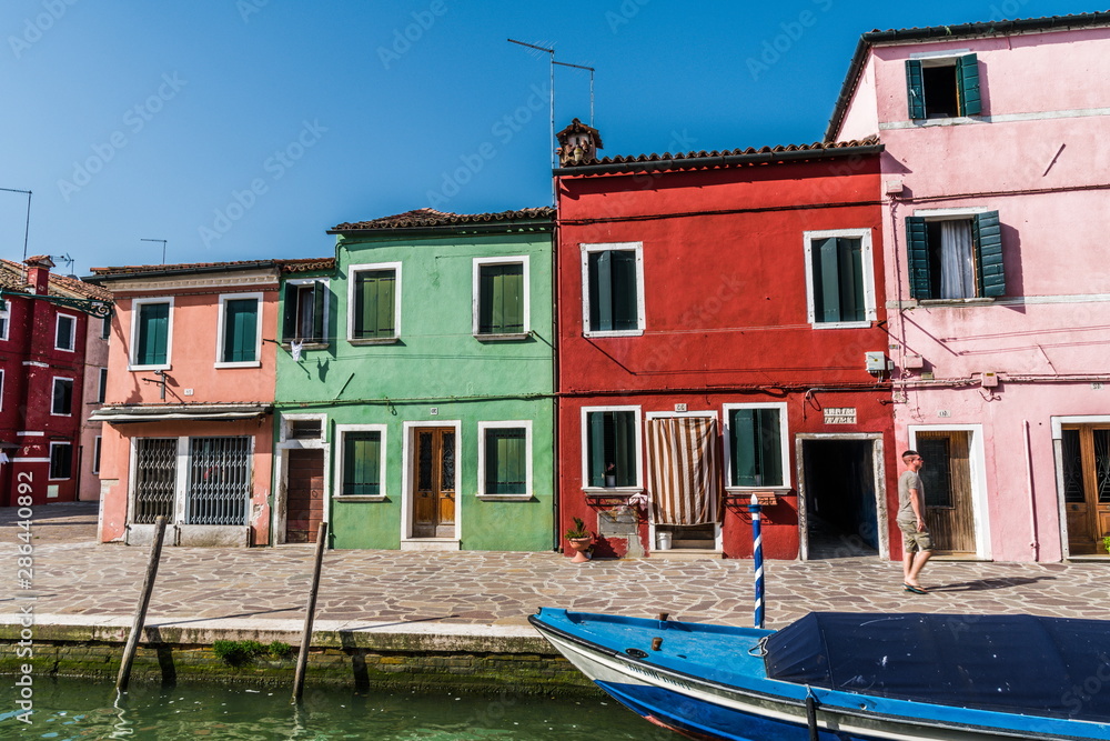 Colored houses on the Bank of a narrow channel