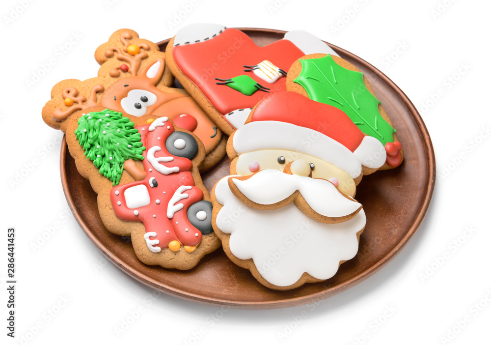 Plate with tasty Christmas cookies on white background Plate with tasty Christmas cookies on white background
