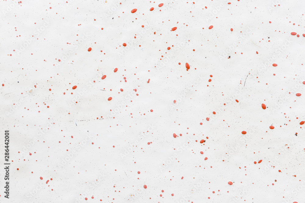 Fototapeta premium Close-up of a white fiberglass (fibreglass) surface with red dots. High resolution full frame abstract background. Copy space.