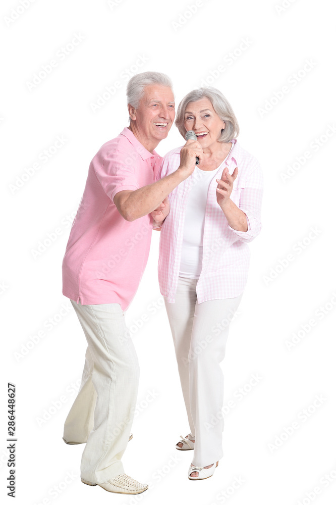 Full length portrait of senior couple singing isolated Full length portrait of senior couple singing isolated