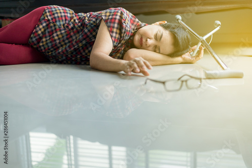 Quadro em tela Senior asian female suffering with faint lying on floor after falling down at ho