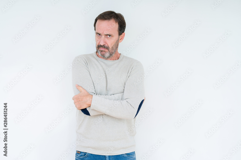 Elegant senior man over isolated background skeptic and nervous, disapproving expression on face with crossed arms. Negative person. Elegant senior man over isolated background skeptic and nervous, disapproving expression on face with crossed arms. Negative person.