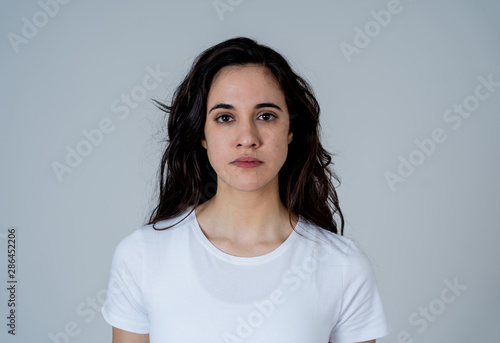 Portrait of beautiful young latin woman with angry and furious face. Human expressions and emotions