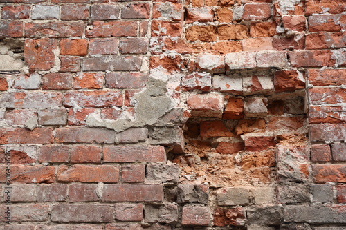 Old broken brick wall background