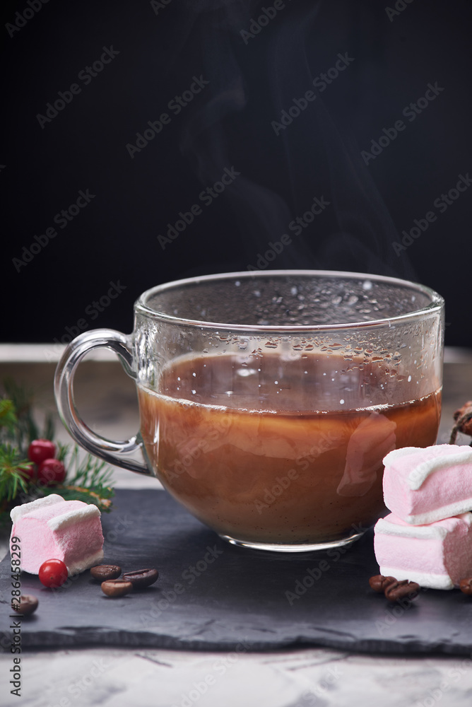Coffee with milk preparation in glass cup with marshmallow Coffee with milk preparation in glass cup with marshmallow