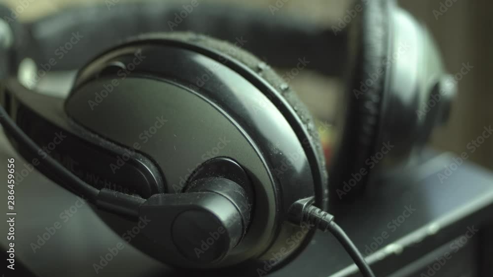 Camera Moving, Old Headphones Lying On A Table Camera Moving, Old Headphones Lying On A Table