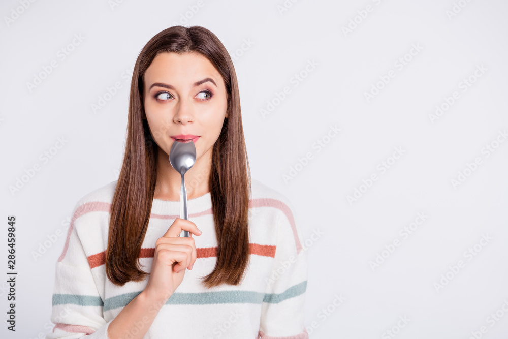 Very hungry lady holding spoon into mouth dream of tasty meal wear striped pullover isolated white background Very hungry lady holding spoon into mouth dream of tasty meal wear striped pullover isolated white background