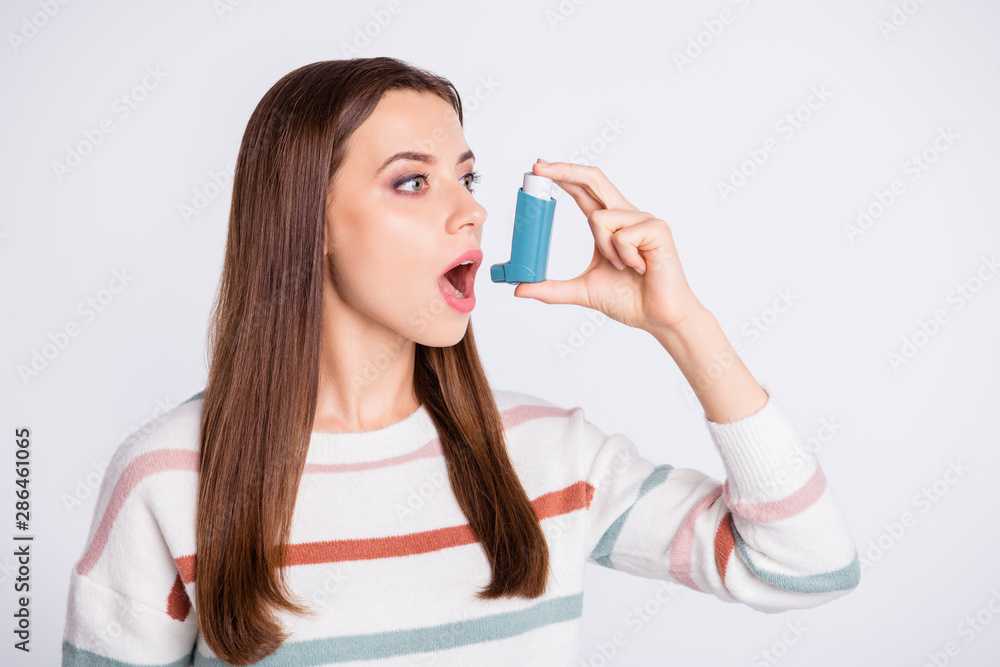 Breathing in bronchospasm attack spray lady wear striped pullover isolated white background Breathing in bronchospasm attack spray lady wear striped pullover isolated white background