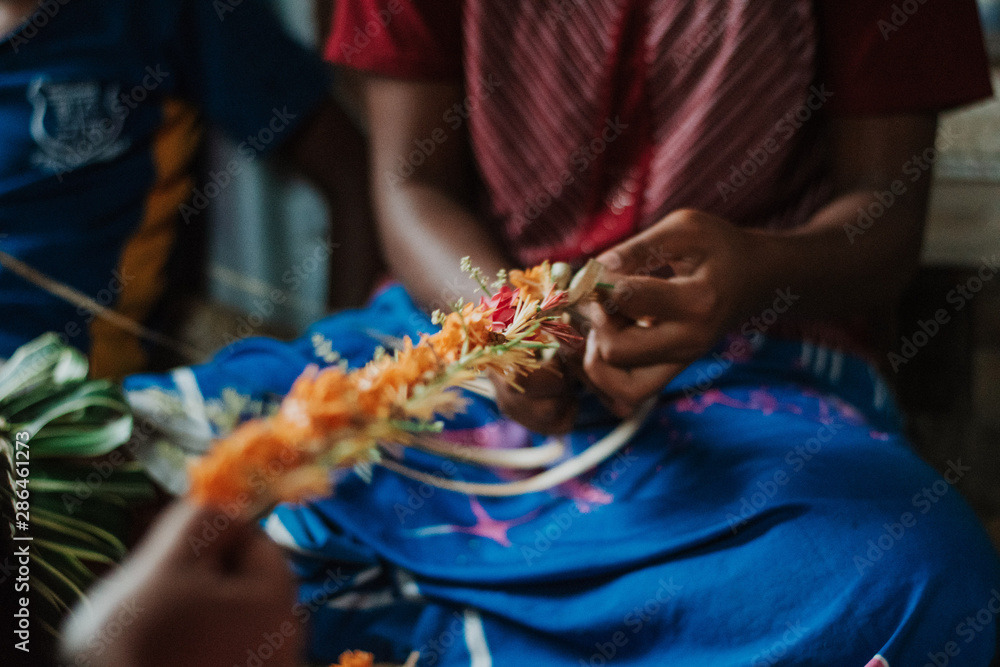 woman weaving Fijian garland Stock Photo Adobe Stock