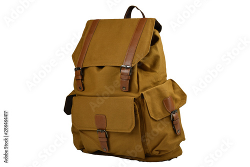 Canvas Backpack accessories isolated hipster background white. brown with yellow caramel canvas bag. Hand made backpack for travelers. Side view