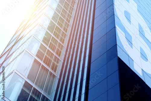 Modern office building with sign Dollar on a background of the b