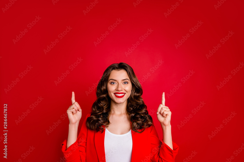 Beautiful lady indicating fingers up empty space dressed formal wear suit isolated burgundy background Beautiful lady indicating fingers up empty space dressed formal wear suit isolated burgundy background
