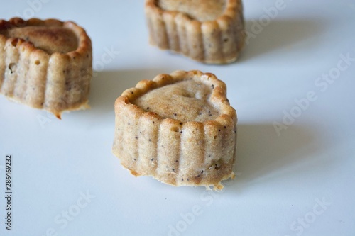 Tasty sweet vegan muffins on the white table.