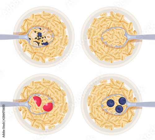 a spoonful of muesli oatmeal over the bowl with fruits isolated on a white background