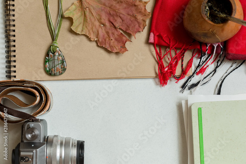 Fototapeta Naklejka Na Ścianę i Meble -  Autumn leaf and camera on the table. Autumn flatley