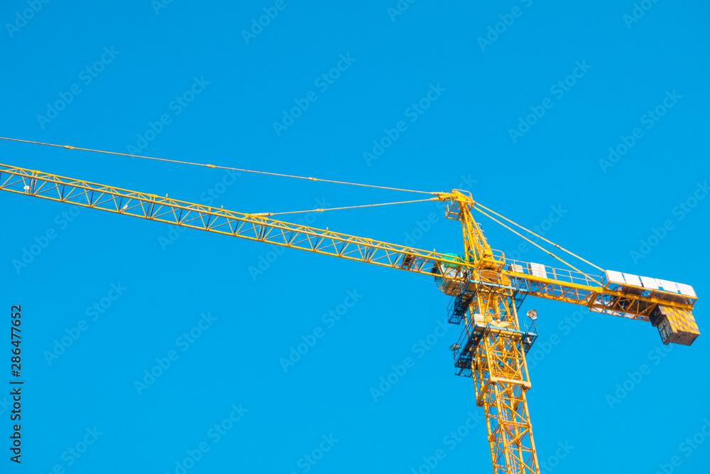 Construction site with cranes on sky background Construction site with cranes on sky background