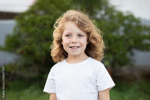 Funny blond kid with long hair