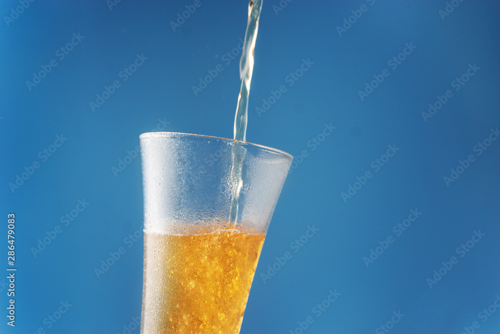 custom made wallpaper toronto digitalBeer being pour on a glass against a blue background