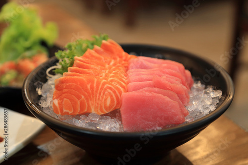 Japanese foods, fresh salmon and tuna sashimi sliced served on ice.