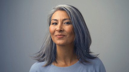 Cute Middle-Aged Asian Woman Looking Aside