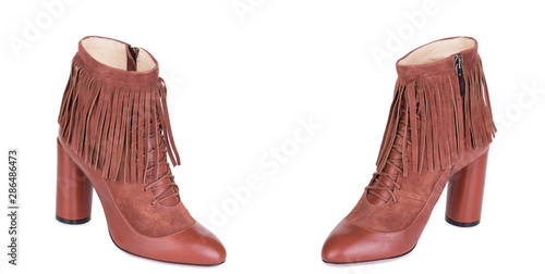 Pair of classical woman cowboy suede boots shoes. Two isolated.