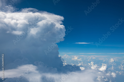 The blue sky and white clouds at an altitude of 10,000 meters under the sun © Weiming