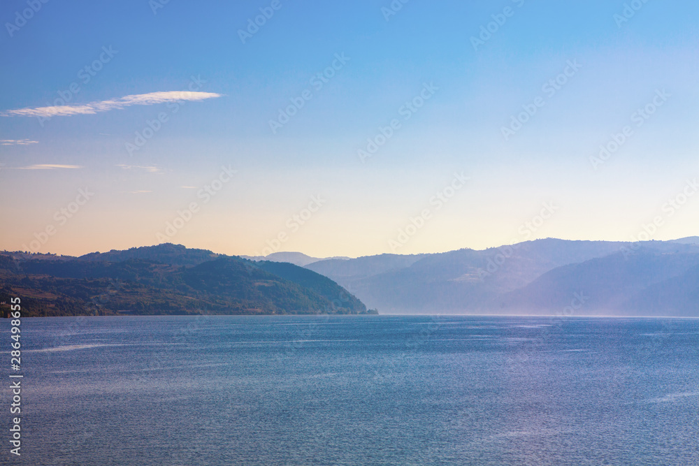 Fototapeta premium Beautiful landscape of blue mountains and lake