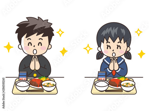 給食を食べる中高生
