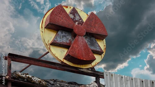 radiation sign with clouds on background