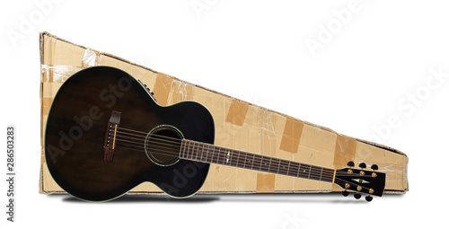 Postage and packing service, Music and sound - Black acoustic guitar and package isolated