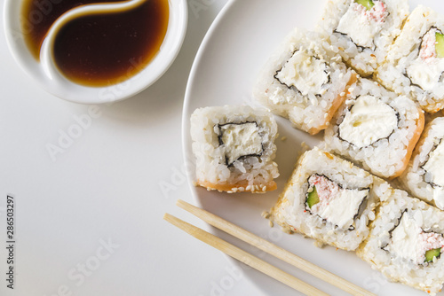 Sushi plate with sauce and chopsticks