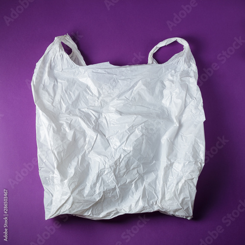 White Disposable Plastic Bag On Purple Background