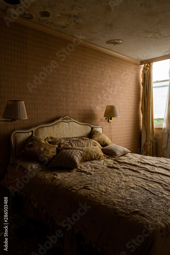 Derelict Plush Bed in Hotel Room - Abandoned Nevele Grande Resort - Catskill Mountains, New York photo