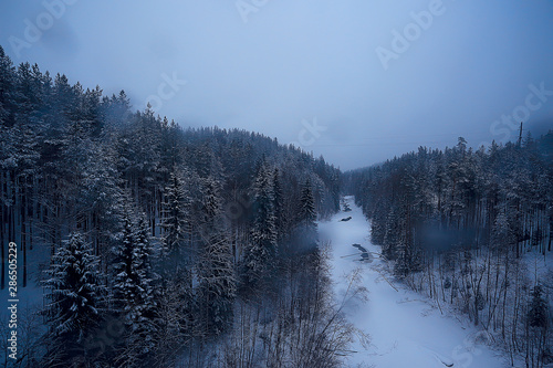 river in winter landscape / snowy view river in icy landscape, winter mist in panoramic landscape © kichigin19