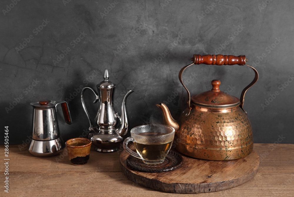 Group of arabic tea in glass and metal tea pot,Tea set with a blank space for a text Group of arabic tea in glass and metal tea pot,Tea set with a blank space for a text