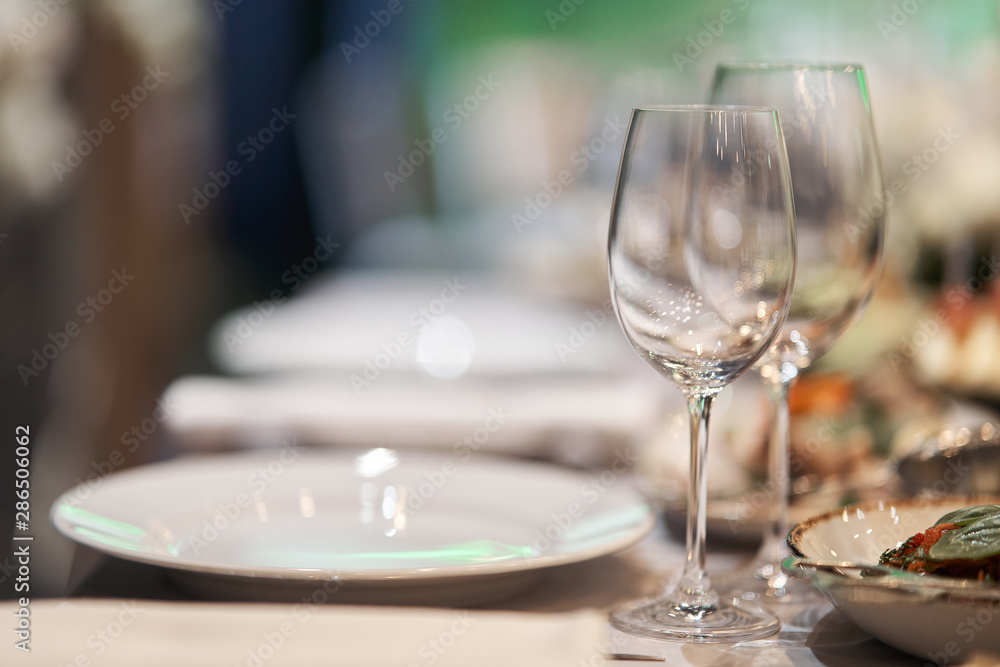 Table set for an event party or wedding reception. Table set for an event party or wedding reception.