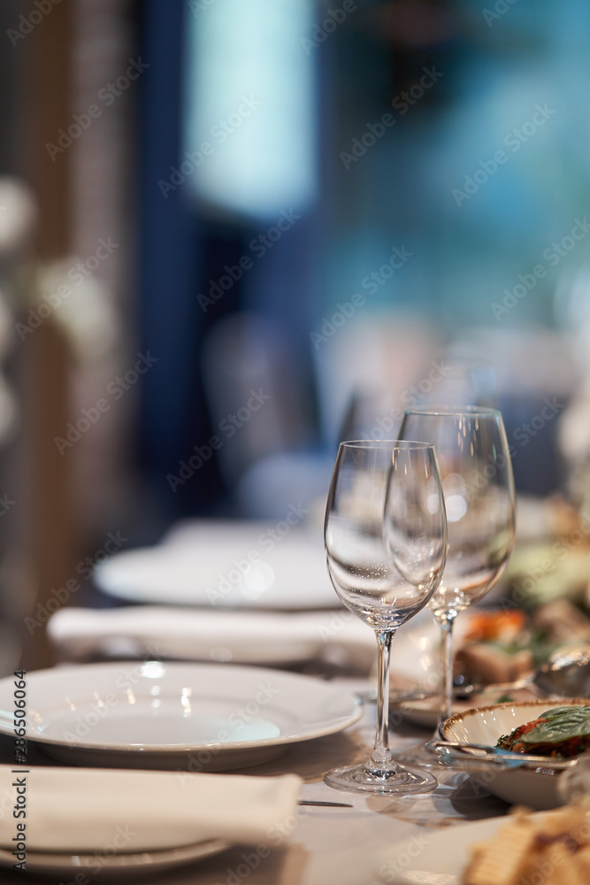 Table set for an event party or wedding reception. Table set for an event party or wedding reception.