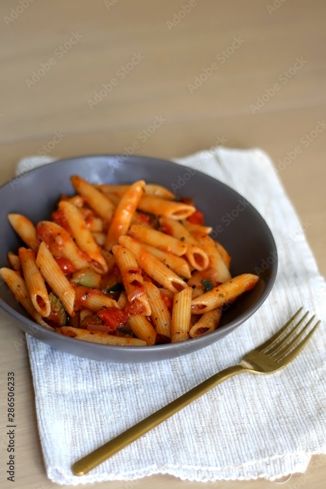 Plate of pasta with tomato sauce and eggplant. Selective focus. Plate of pasta with tomato sauce and eggplant. Selective focus.