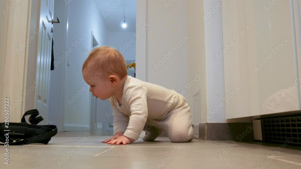 Baby Girl Crawling and Playing on Tiled Floor Baby Girl Crawling and Playing on Tiled Floor