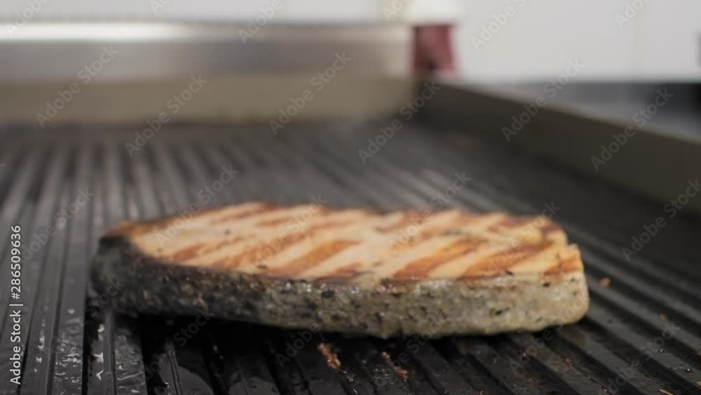 Cooking salmon on an electric grill in a restaurant. Cooking salmon on an electric grill in a restaurant.