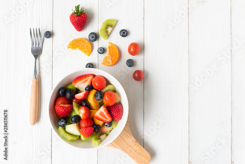 Fototapeta Naklejka Na Ścianę i Meble -  Healthy Fruits.Â  Fresh fruits salad diet slim fit for healthy lifestyle women.Â  Weight Loss and Diet Concept