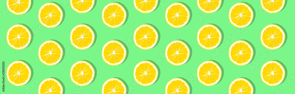 Fresh lemon (lemons) pattern on pink background. Minimal concept. Summer minimal concept. Flat lay