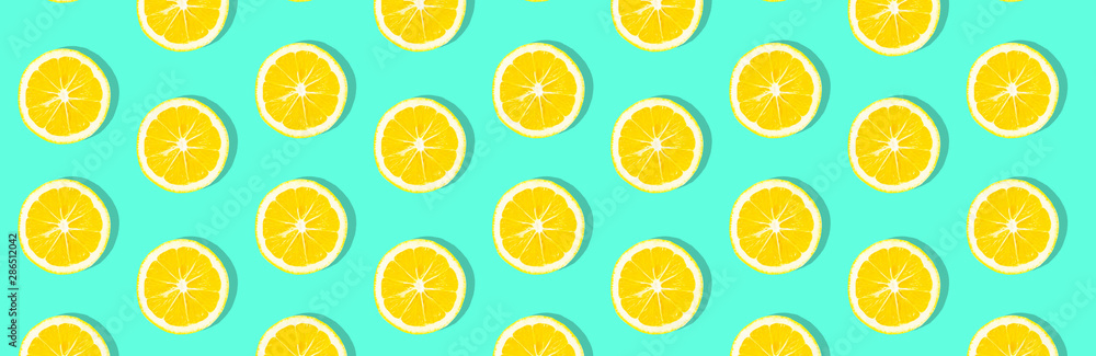 Fresh lemon (lemons) pattern on pink background. Minimal concept. Summer minimal concept. Flat lay Fresh lemon (lemons) pattern on pink background. Minimal concept. Summer minimal concept. Flat lay