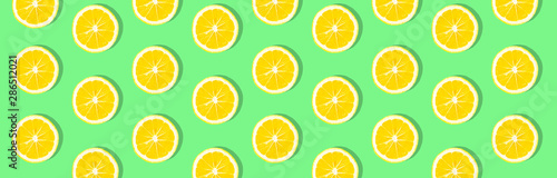 Fresh lemon (lemons) pattern on pink background. Minimal concept. Summer minimal concept. Flat lay